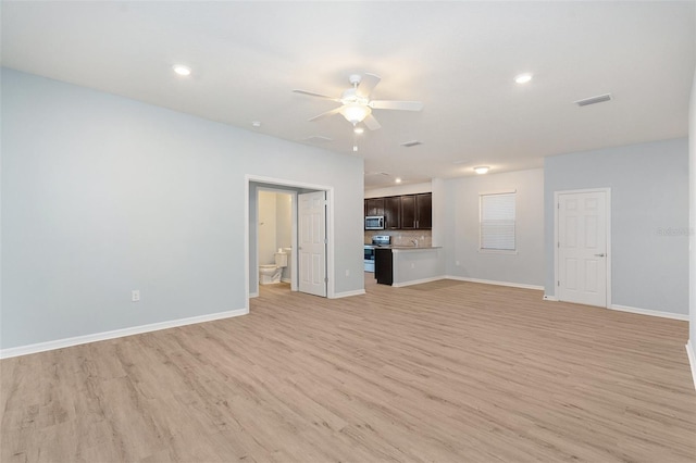 unfurnished living room featuring light hardwood / wood-style flooring and ceiling fan