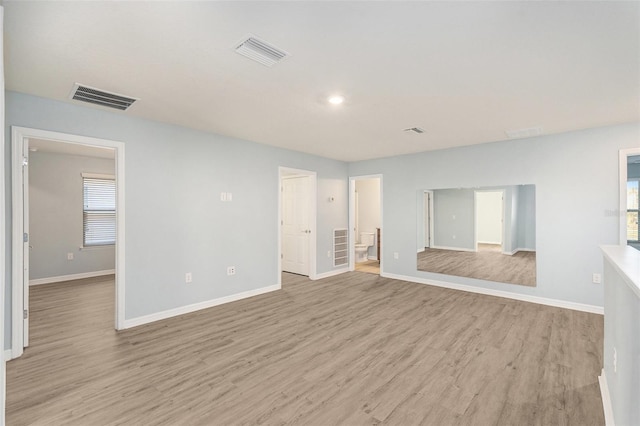 unfurnished living room featuring light hardwood / wood-style flooring