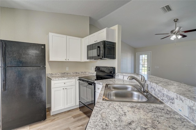 3776 Junction St, North Port, FL 34288 - kitchen with black appliances, lofted ceiling, a sink, light wood finished floors, and light countertops