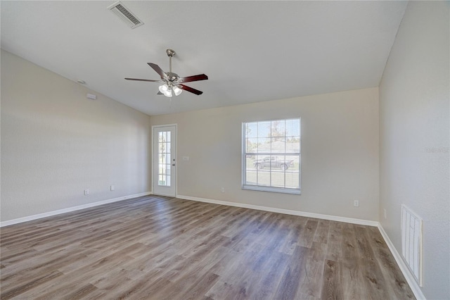 unfurnished room with ceiling fan and light wood-type flooring