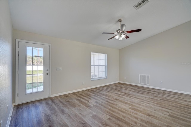 empty room featuring light wood-type flooring and ceiling fan