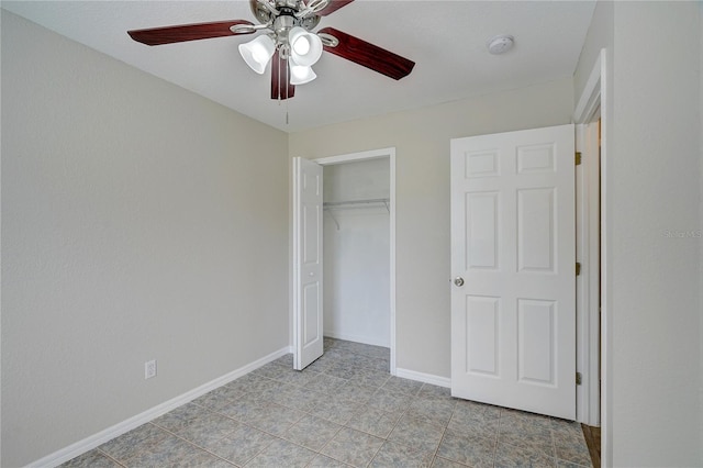 unfurnished bedroom featuring ceiling fan, a closet, and light tile patterned floors