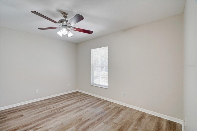 empty room featuring ceiling fan and light wood-type flooring