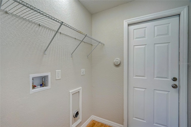 washroom featuring hookup for an electric dryer, washer hookup, and wood-type flooring