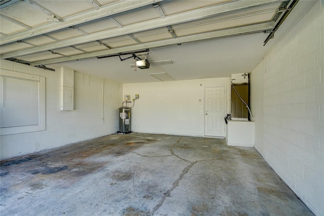 garage with electric water heater and a garage door opener