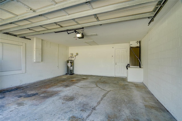 3776 Junction St, North Port, FL 34288 - garage with a garage door opener, water heater, and concrete block wall