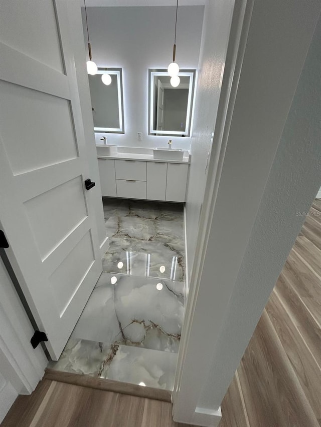 bathroom featuring vanity and hardwood / wood-style flooring