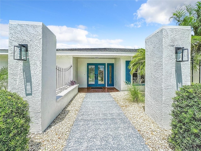 property entrance featuring french doors