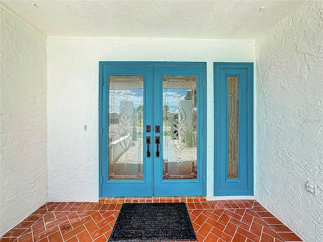 entrance to property featuring french doors