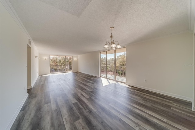 empty room featuring crown molding, a textured ceiling, an inviting chandelier, and dark hardwood / wood-style flooring