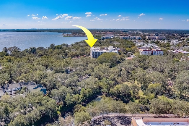 birds eye view of property with a water view