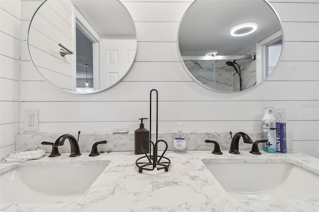 bathroom featuring vanity and tasteful backsplash