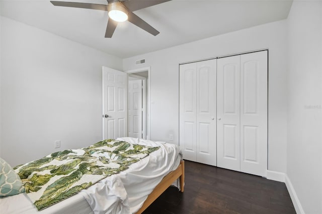 bedroom featuring dark hardwood / wood-style flooring, a closet, and ceiling fan