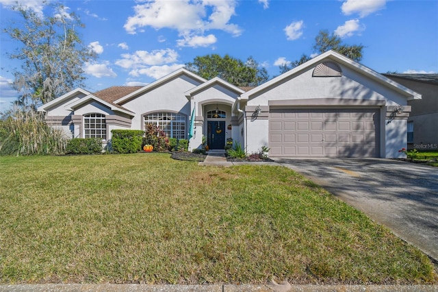 ranch-style home featuring a front lawn and a garage