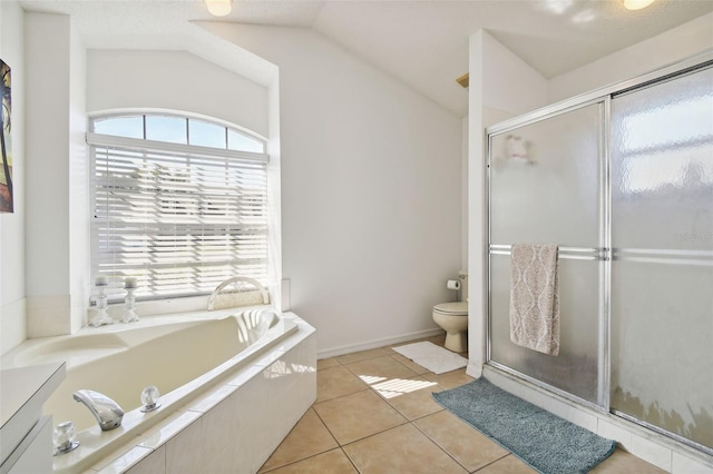 full bathroom featuring lofted ceiling, shower with separate bathtub, toilet, vanity, and tile patterned flooring