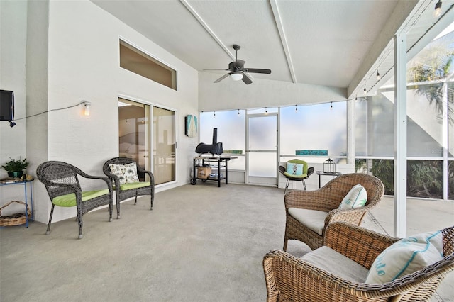 sunroom featuring ceiling fan and lofted ceiling