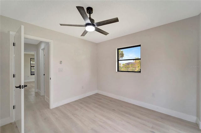 empty room with light hardwood / wood-style floors and ceiling fan