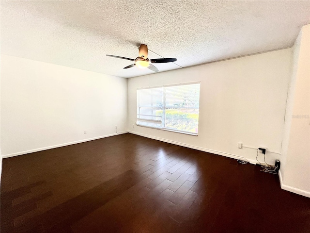 spare room with a textured ceiling, wood-type flooring, and ceiling fan