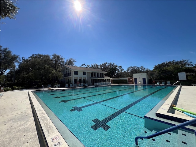 view of swimming pool featuring a patio area