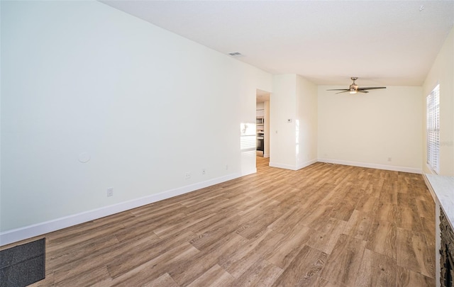 3455 Countryside Blvd Unit 52, Clearwater, FL 33761 - unfurnished room featuring visible vents, light wood-type flooring, a ceiling fan, and baseboards