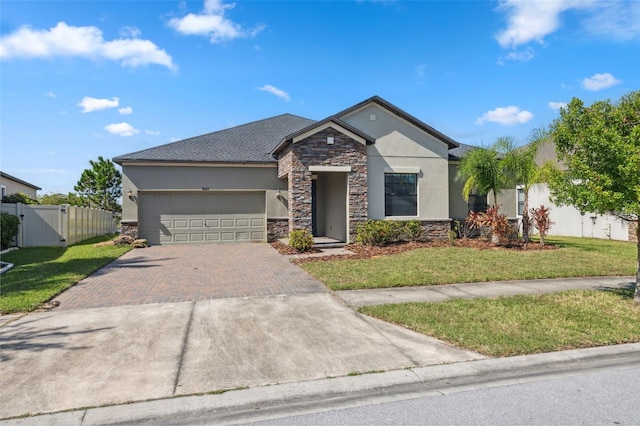 view of front facade featuring a front yard and a garage