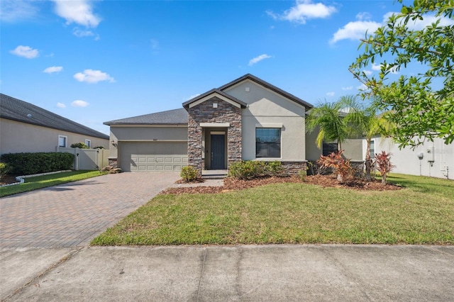 view of front facade featuring a front yard and a garage