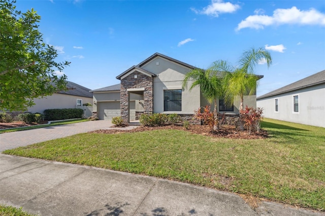 view of front facade featuring a front yard and a garage