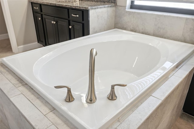 interior details featuring tiled bath