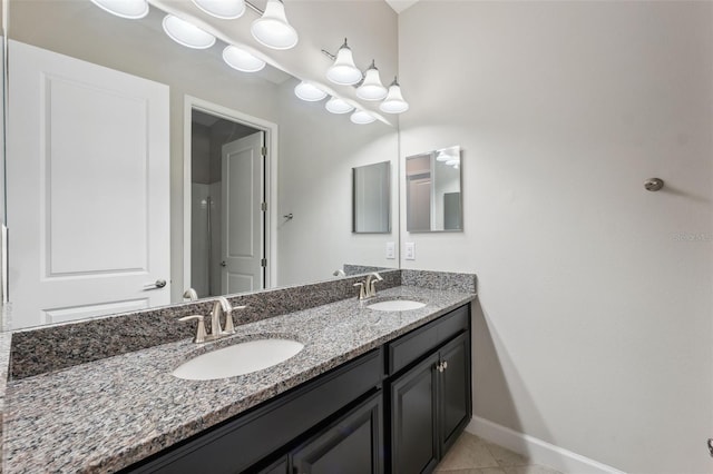 bathroom featuring vanity and tile patterned flooring