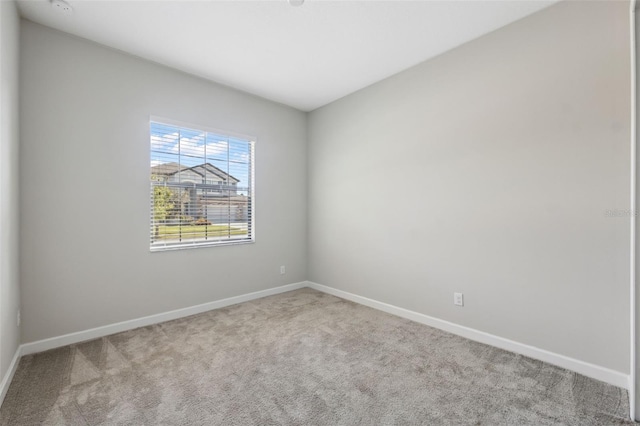 unfurnished room with carpet flooring