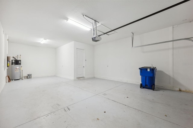 garage featuring water heater and a garage door opener