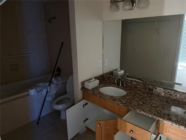 bathroom featuring tile patterned flooring, vanity, and toilet