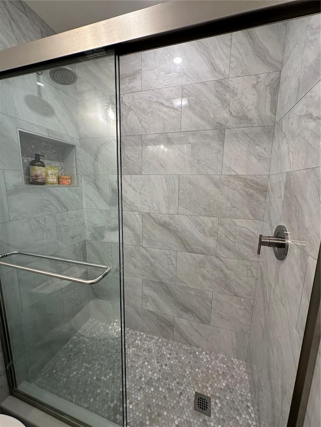 bathroom with an enclosed shower