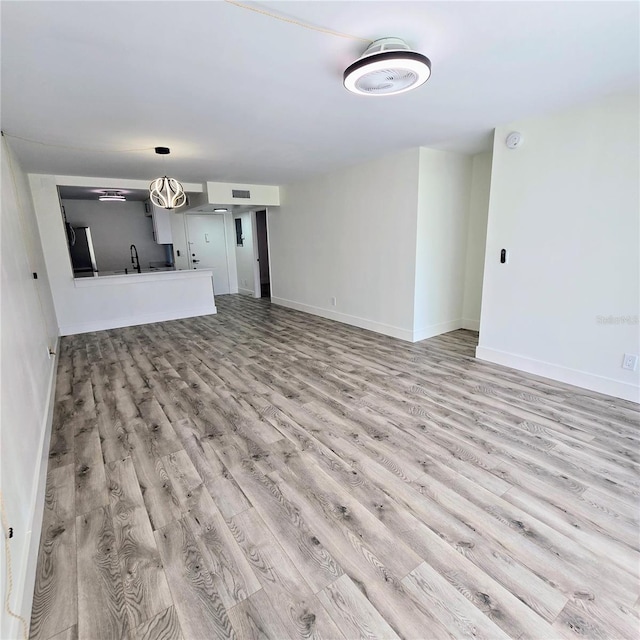 unfurnished living room featuring light wood-type flooring