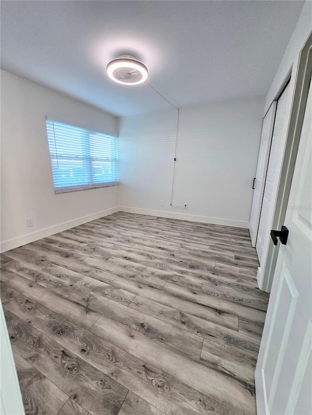 empty room featuring hardwood / wood-style flooring