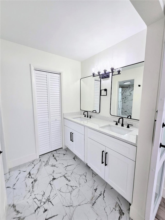 bathroom with vanity and a shower