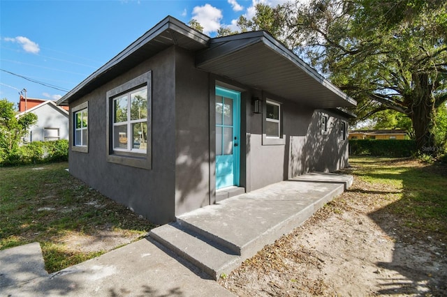 view of side of home featuring a yard