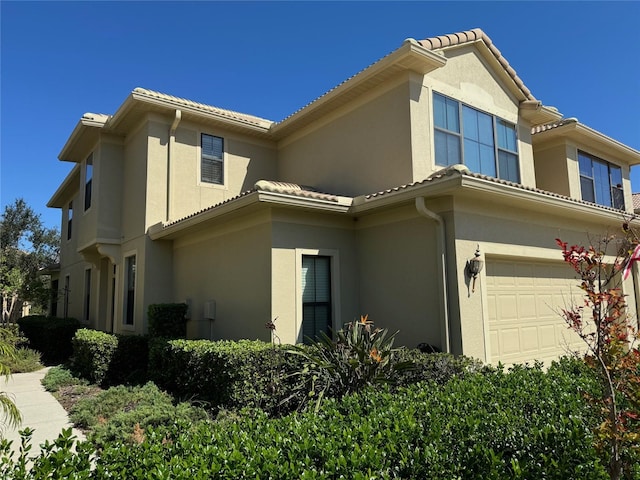 view of property exterior with a garage