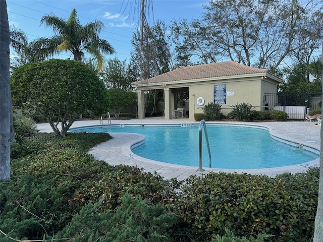 view of swimming pool with a patio area