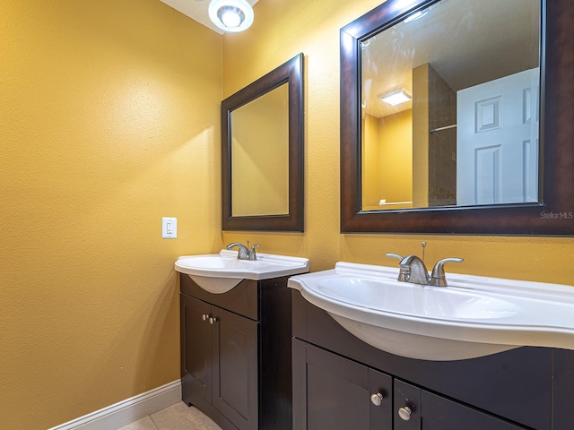 bathroom featuring tile patterned flooring and vanity