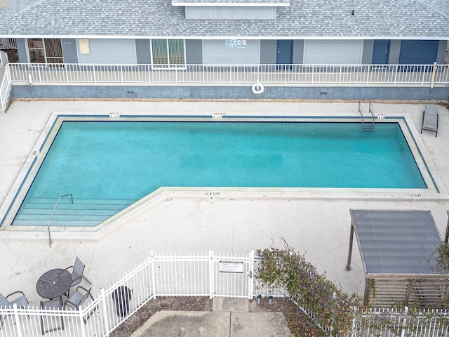 view of swimming pool with a patio area