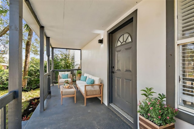 view of exterior entry featuring a porch