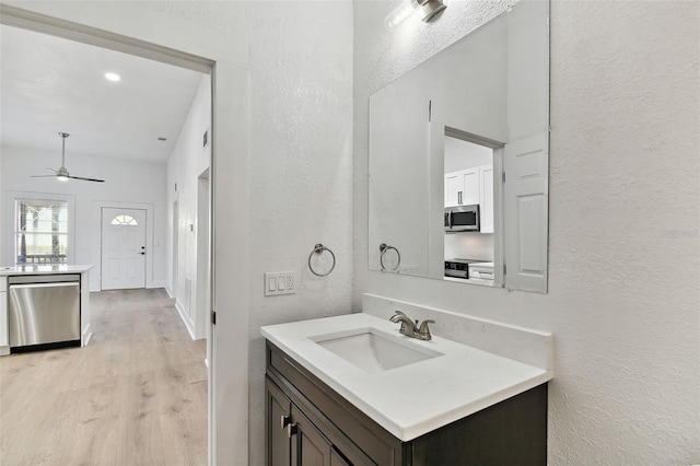 bathroom featuring vanity, ceiling fan, and hardwood / wood-style floors