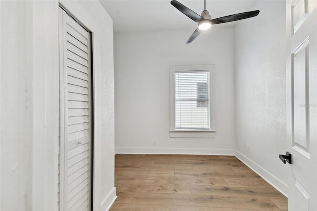 unfurnished bedroom with ceiling fan and light hardwood / wood-style flooring