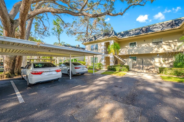 view of vehicle parking with a carport