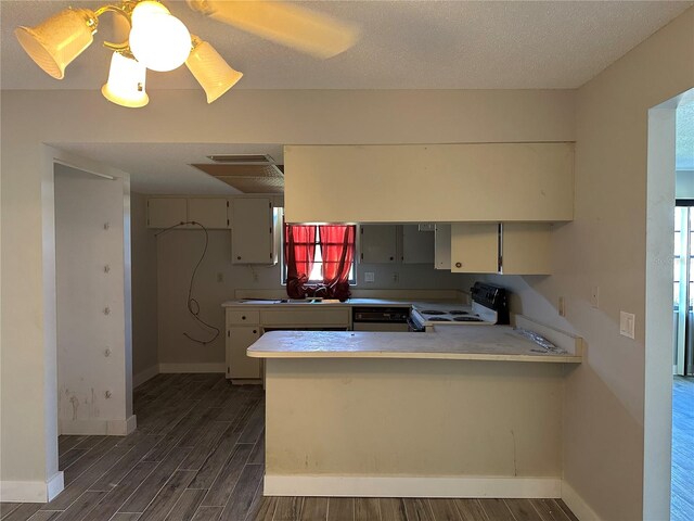 kitchen with white electric range, kitchen peninsula, dark hardwood / wood-style flooring, a textured ceiling, and ceiling fan