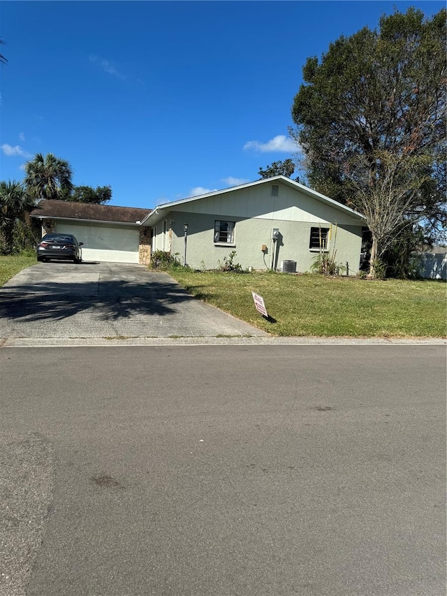 view of front facade with a front yard and a garage