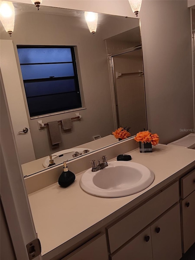 bathroom with vanity and walk in shower