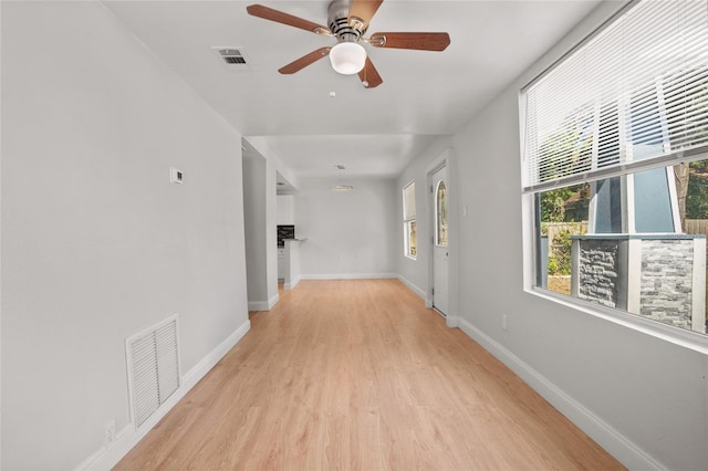 hall with light hardwood / wood-style floors