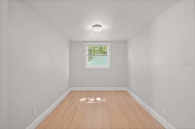 empty room featuring wood-type flooring